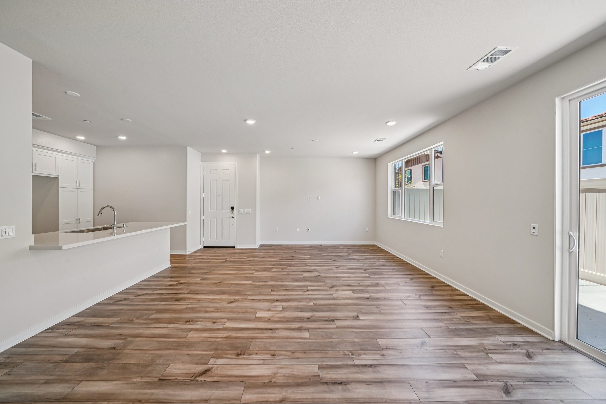 A large empty room with white walls.