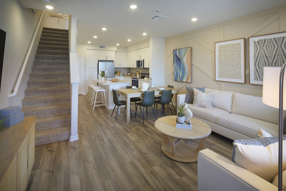 A living room with a wood floor.