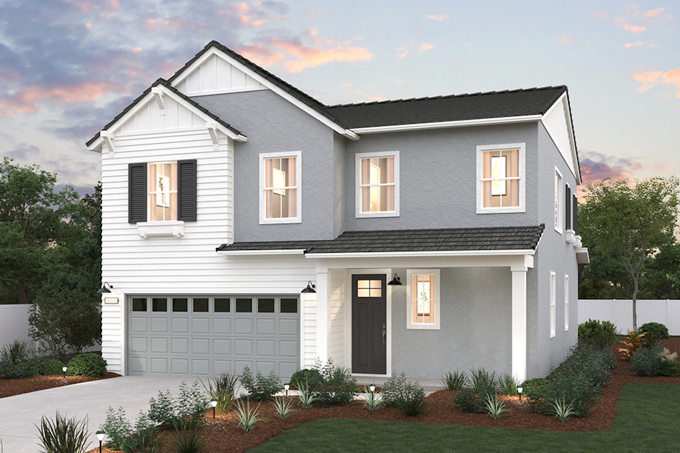 A white house with a garage.