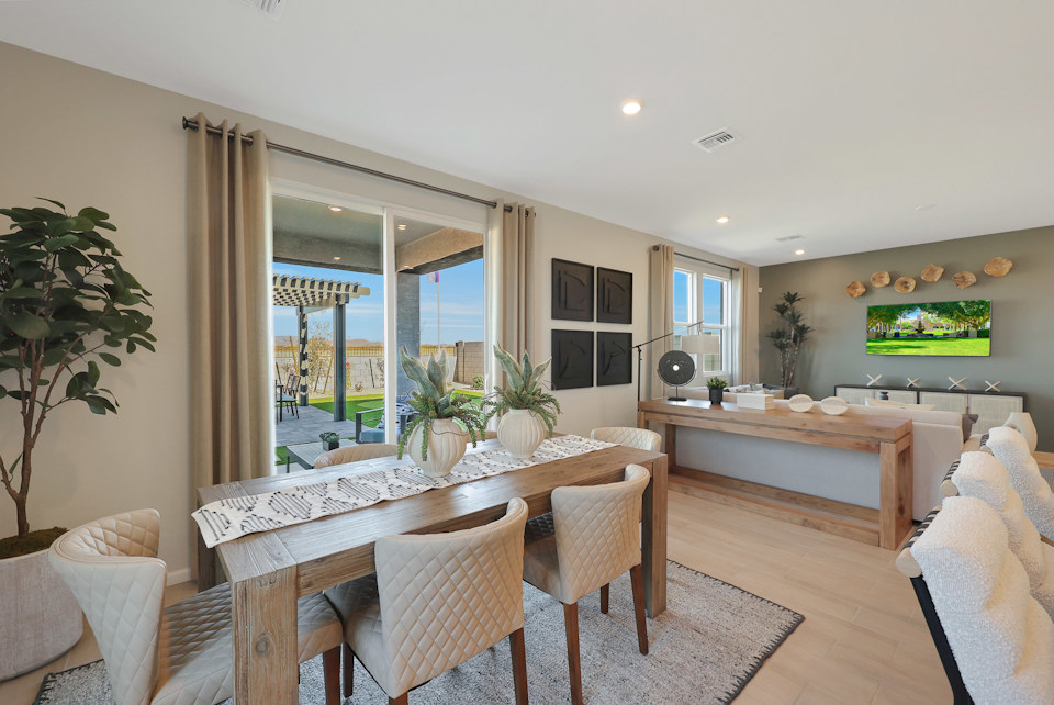 A dining room with a large window.