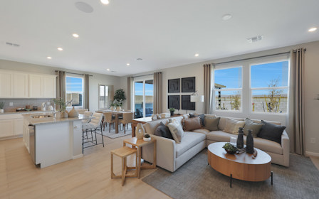 A large living room with a large window.