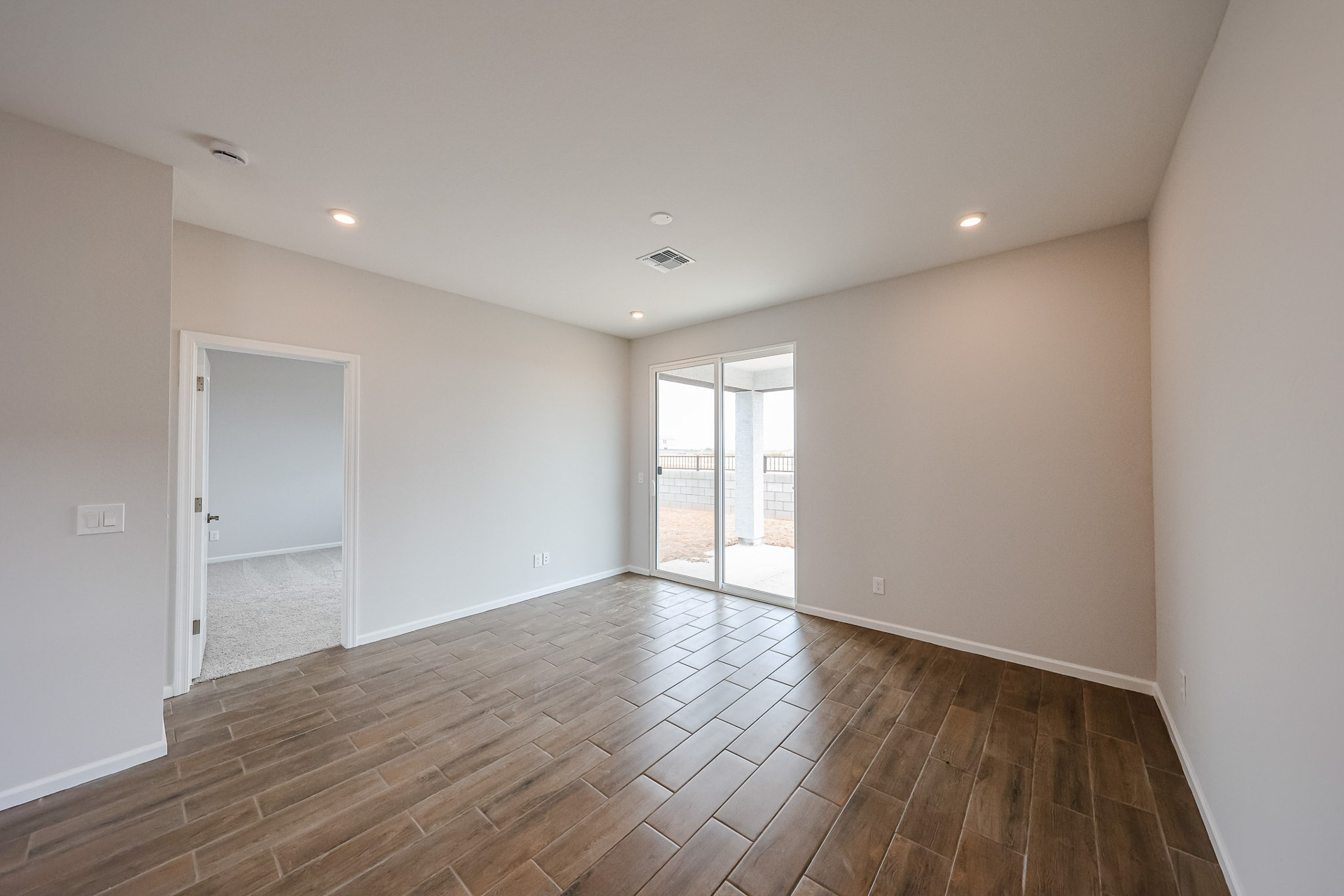 A room with a wood floor and a wood floor.