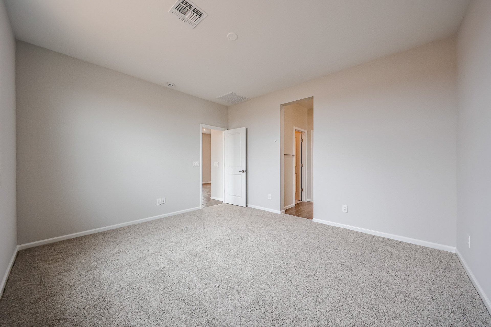 A hallway with white walls.