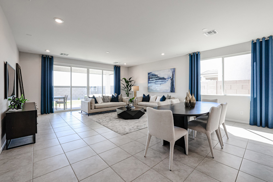 A large living room with a large window.