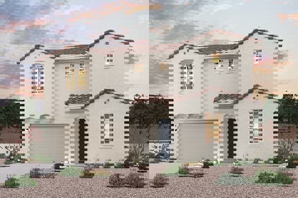 A white house with a driveway.