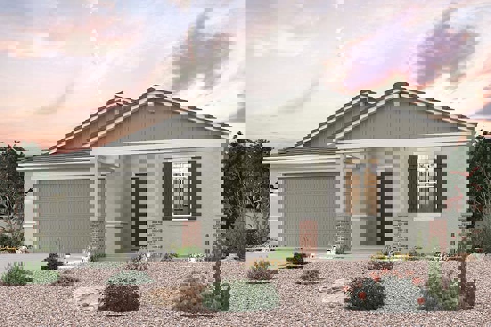 A house with a gravel driveway.