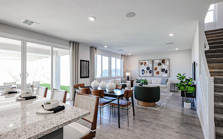 A room with a table and chairs.