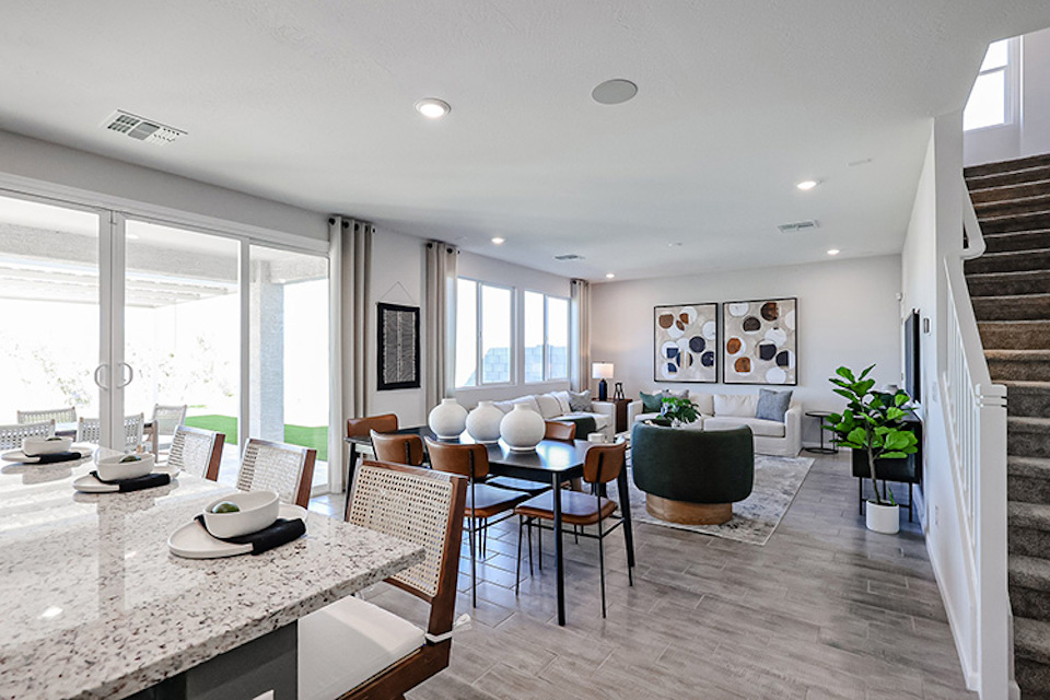 A room with a table and chairs.