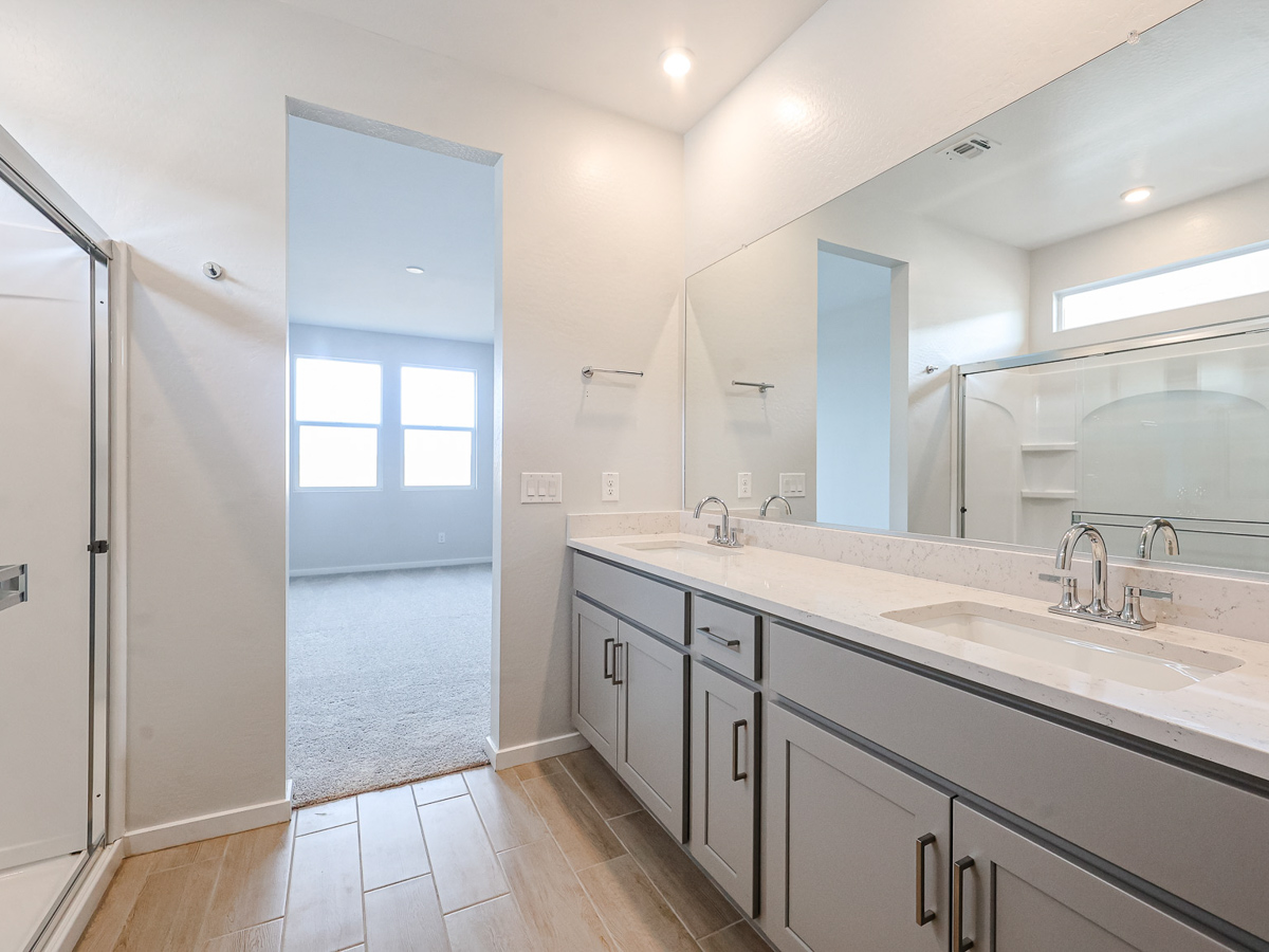 A bathroom with a large mirror.