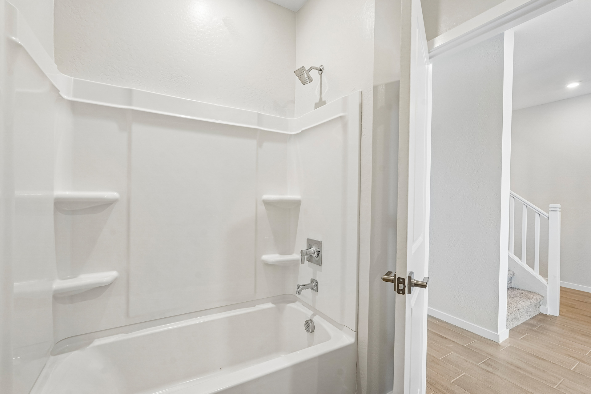 A bathroom with a tub and sink.