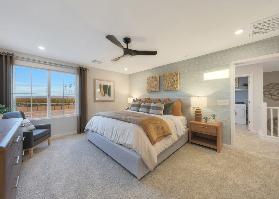 A bedroom with a large bed.