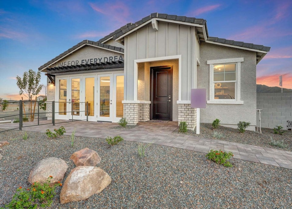 A house with a stone driveway.