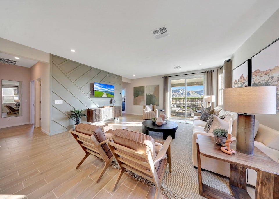 A living room with a wood floor.