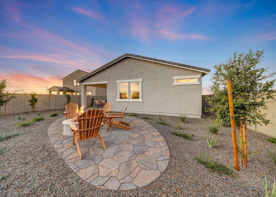 A house with a stone patio.