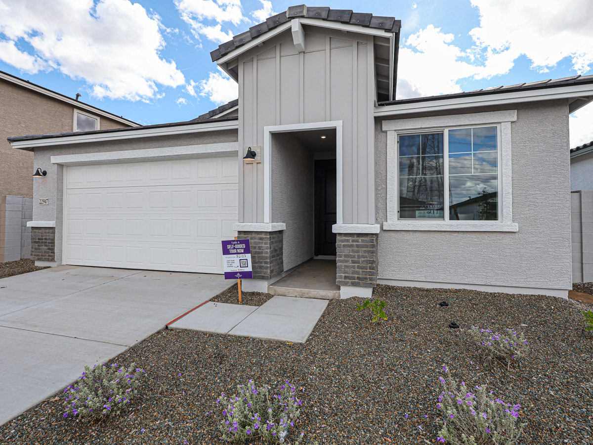 A building with a sign in front.
