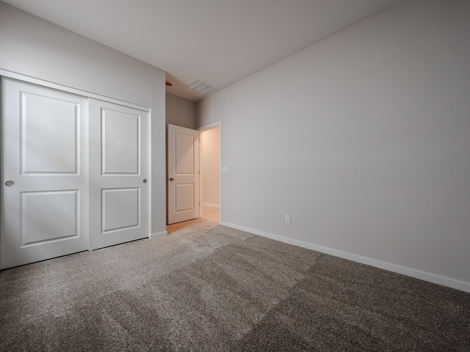 A room with white doors.