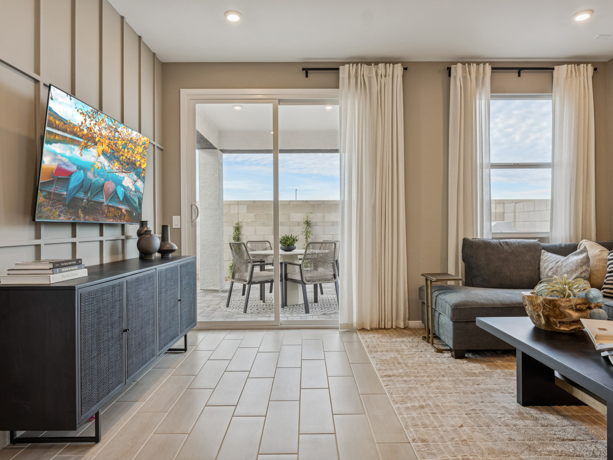 A living room with a large television.