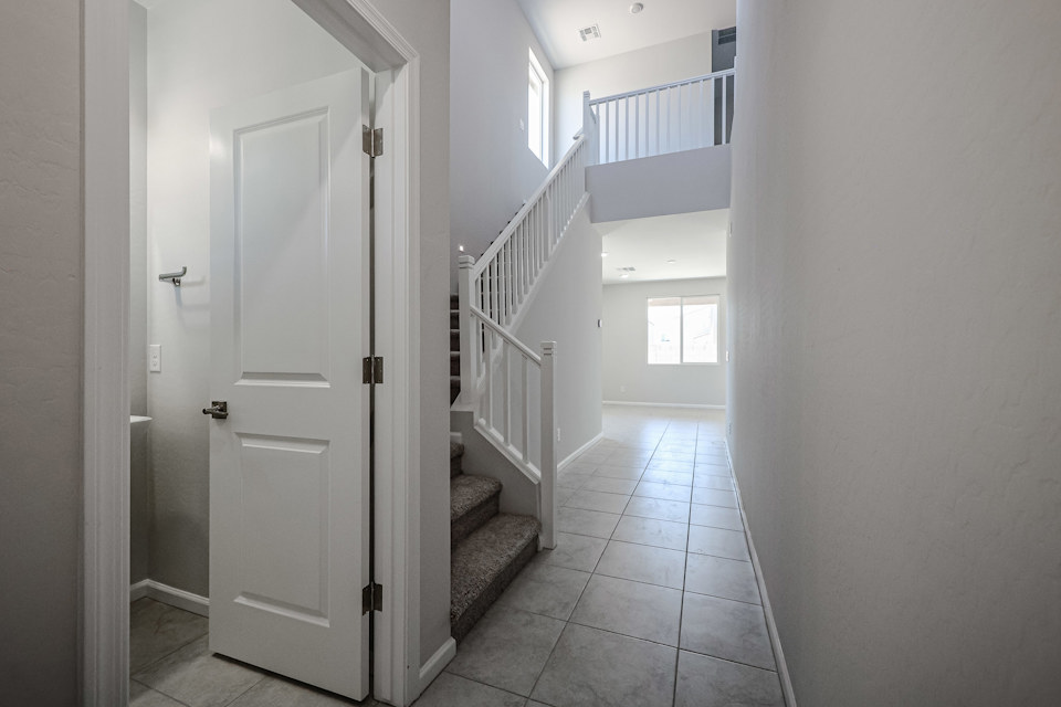 A hallway with white doors.