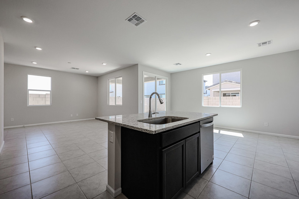 A kitchen with a sink and a countertop.