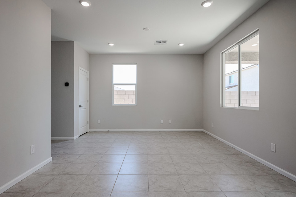 A room with a tile floor and windows.