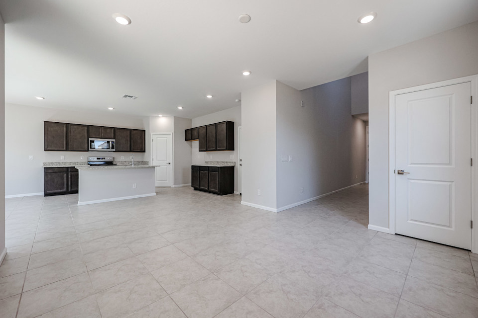 A large kitchen with white cabinets.