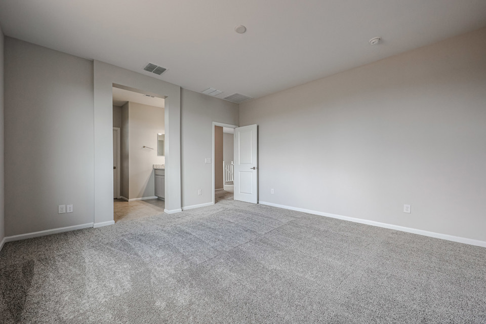 A long hallway with white walls.