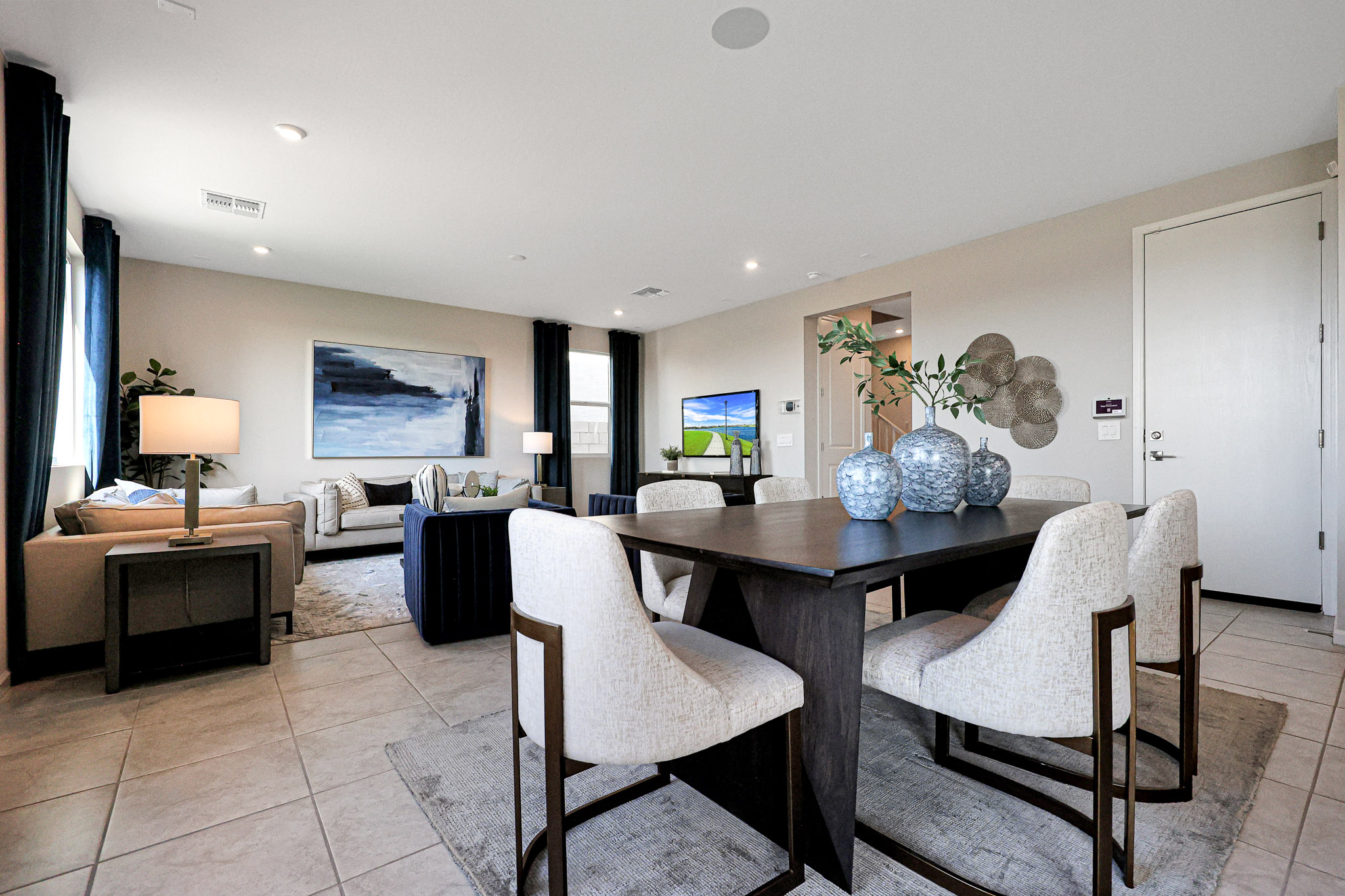 A room with a table and chairs.