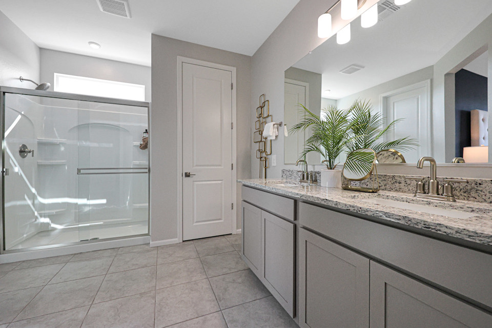 A bathroom with a marble countertop.