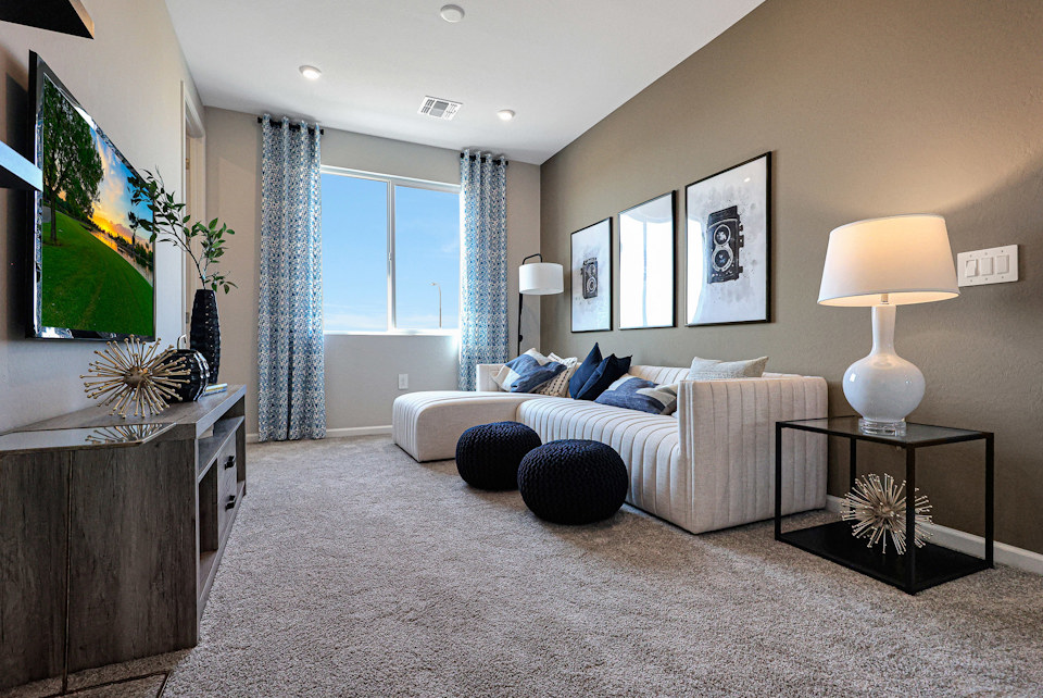 A living room with a tv and couches.