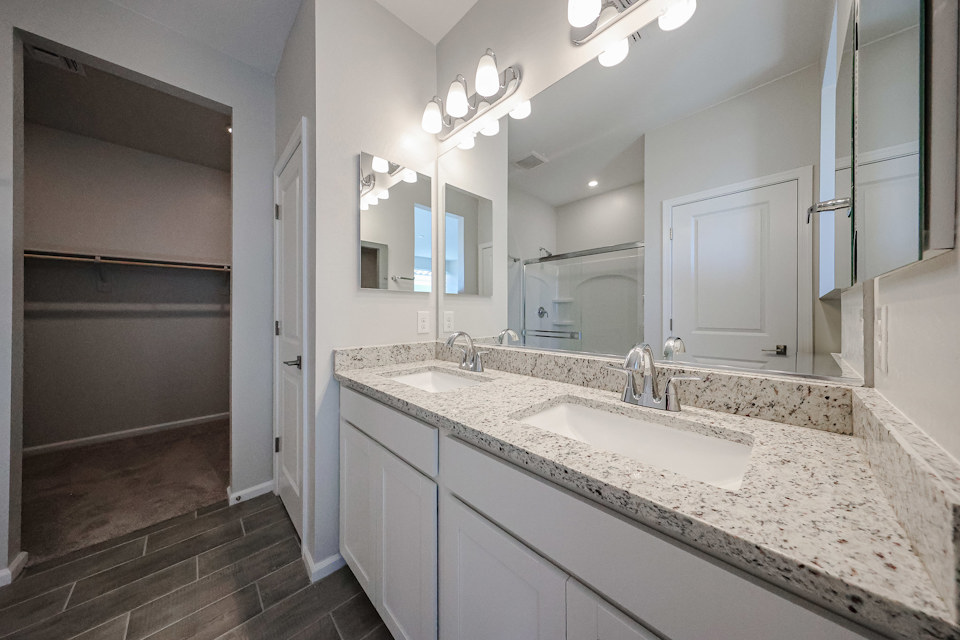 A bathroom with a marble countertop.