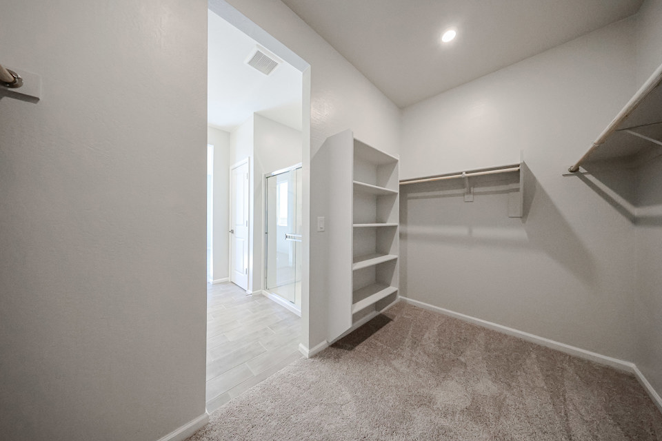 A hallway with white walls.