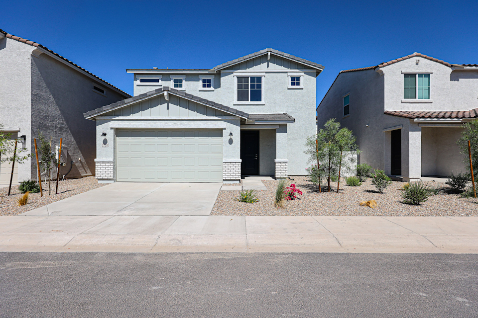 A house with garages and a driveway.