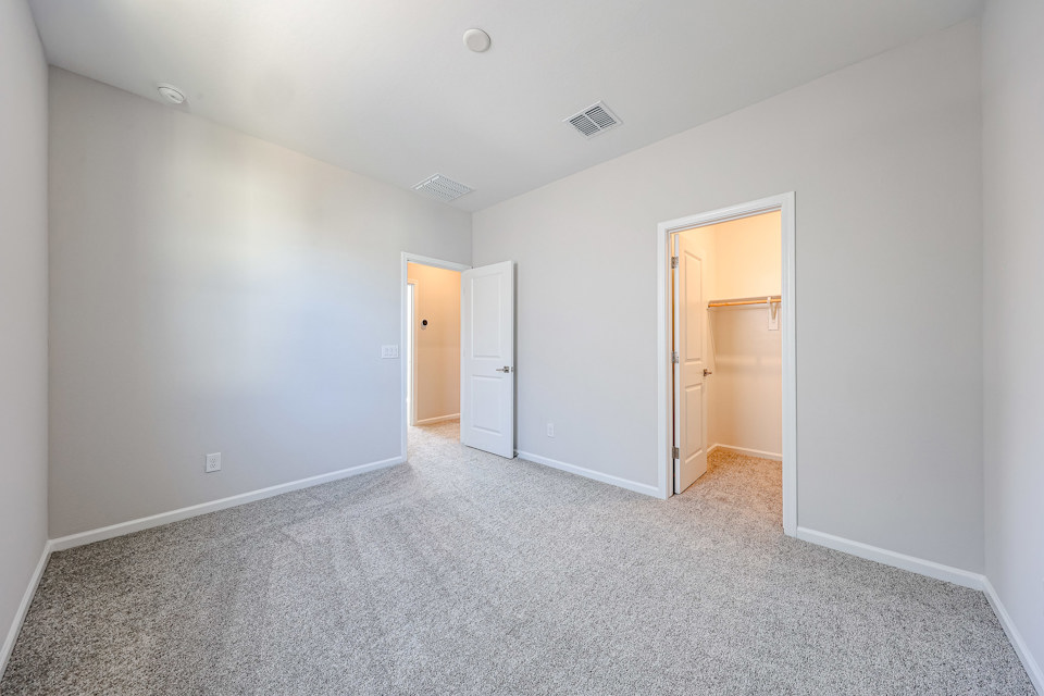 A hallway with white walls.