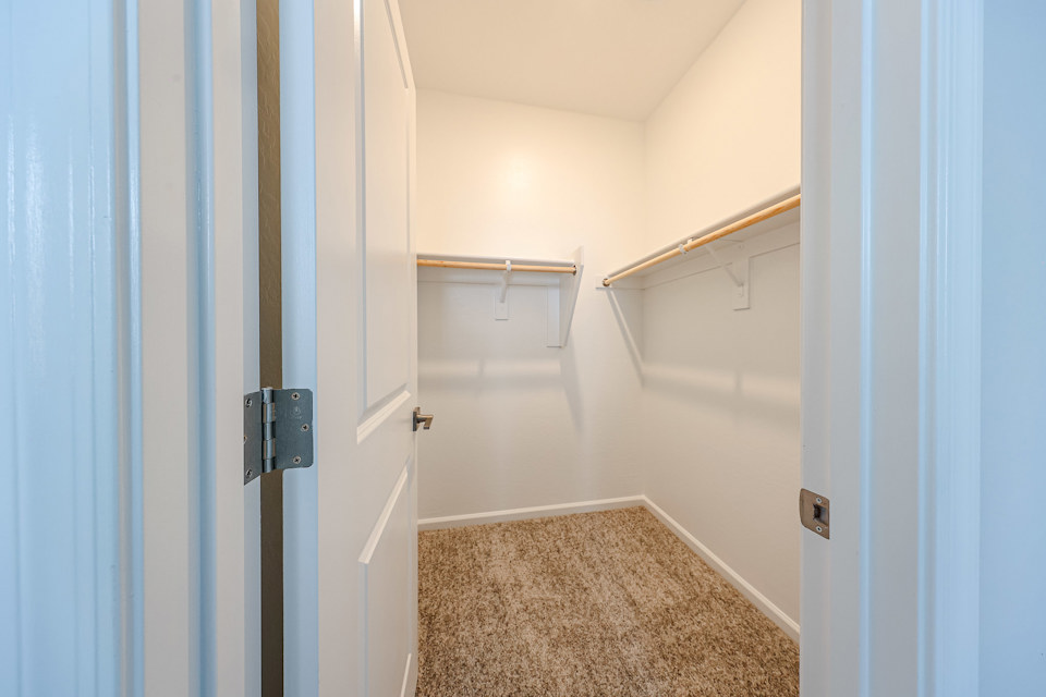 A hallway with white walls.