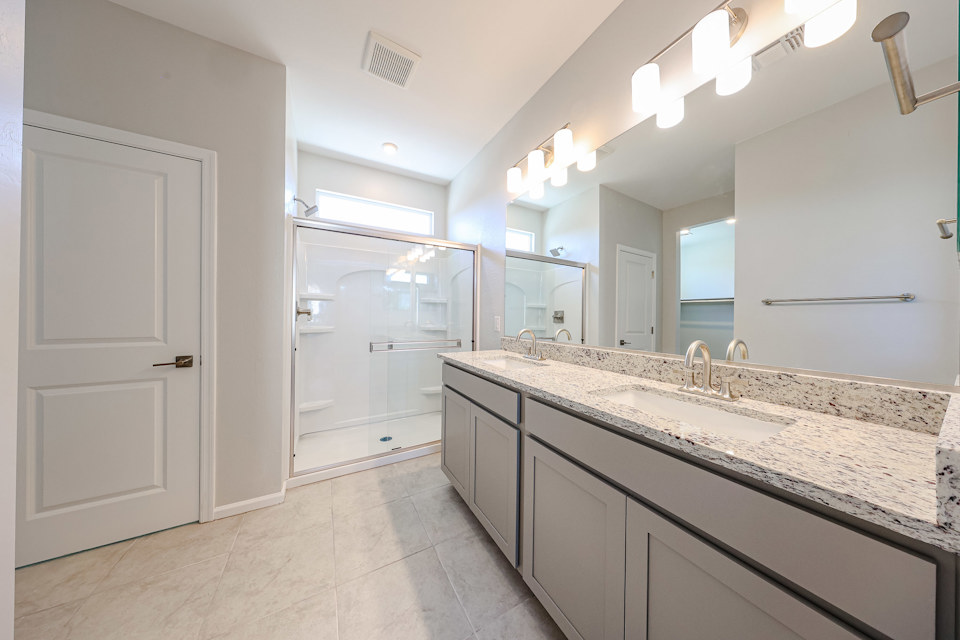A bathroom with a marble countertop.