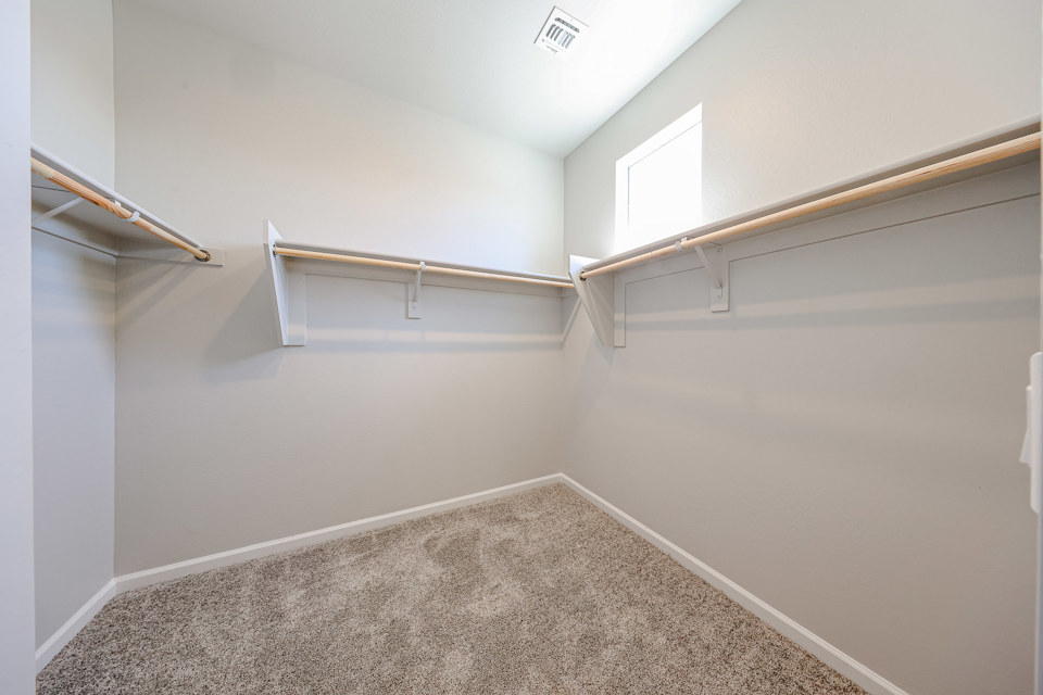 A hallway with a carpet.