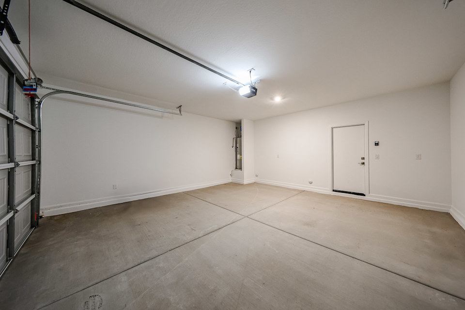 A room with a wood floor and white walls.