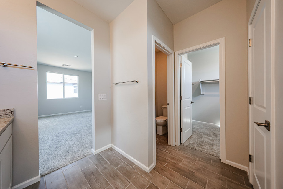 A bathroom with a toilet and a sink.