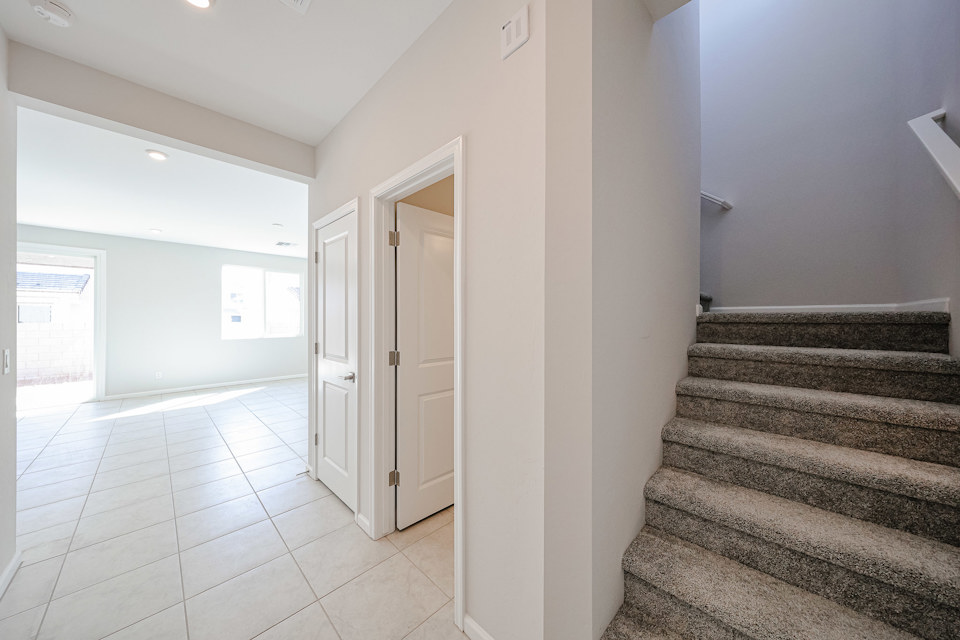 A hallway with white walls.