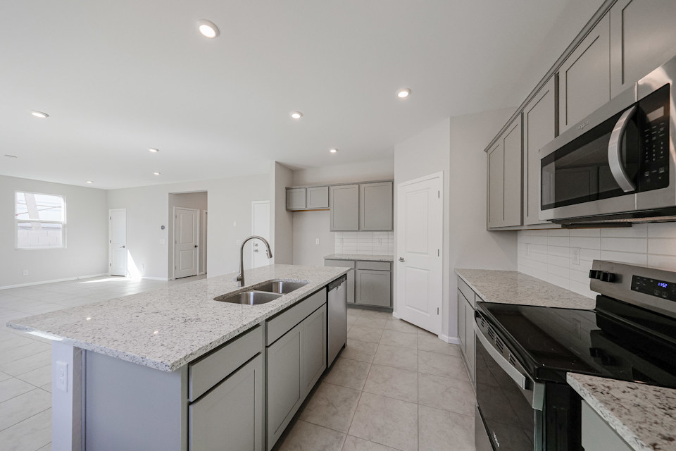 A kitchen with black appliances.