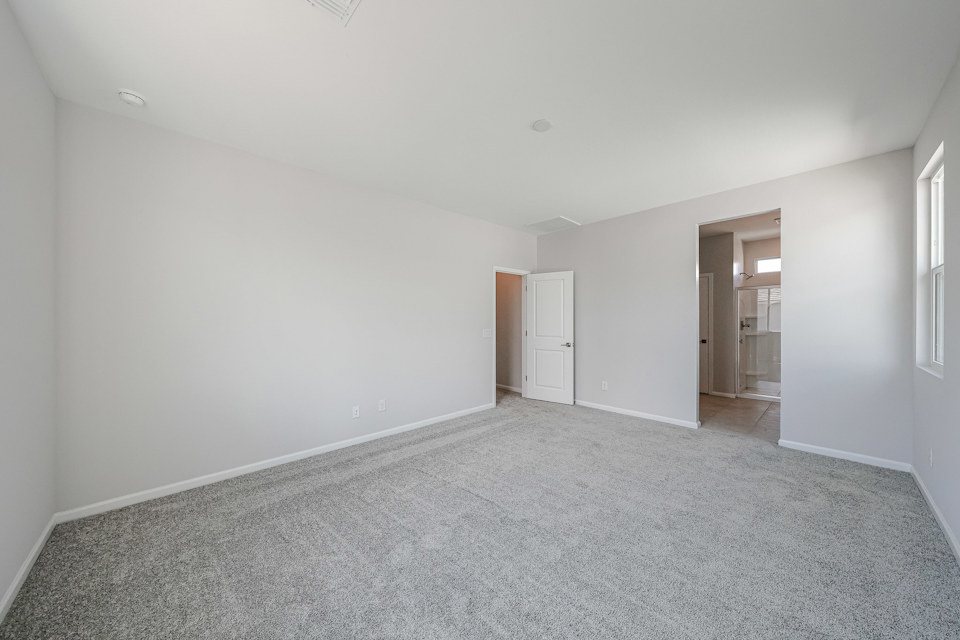 A long hallway with white walls.