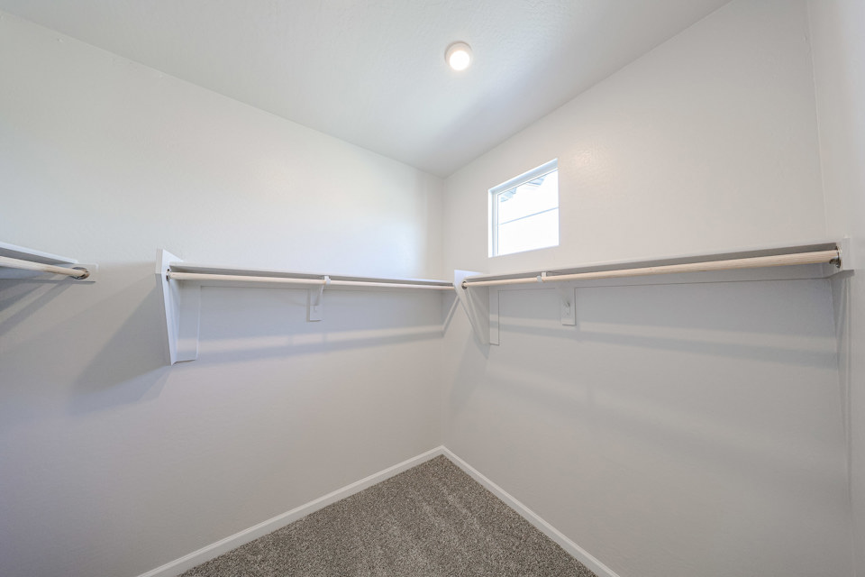 A white room with a staircase.