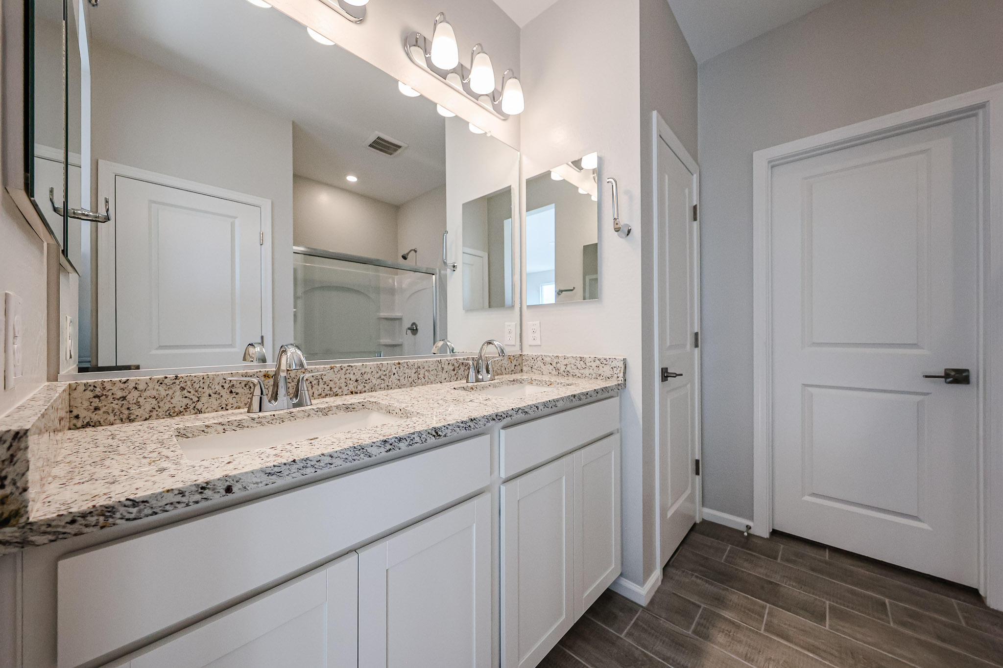 A bathroom with a marble countertop.