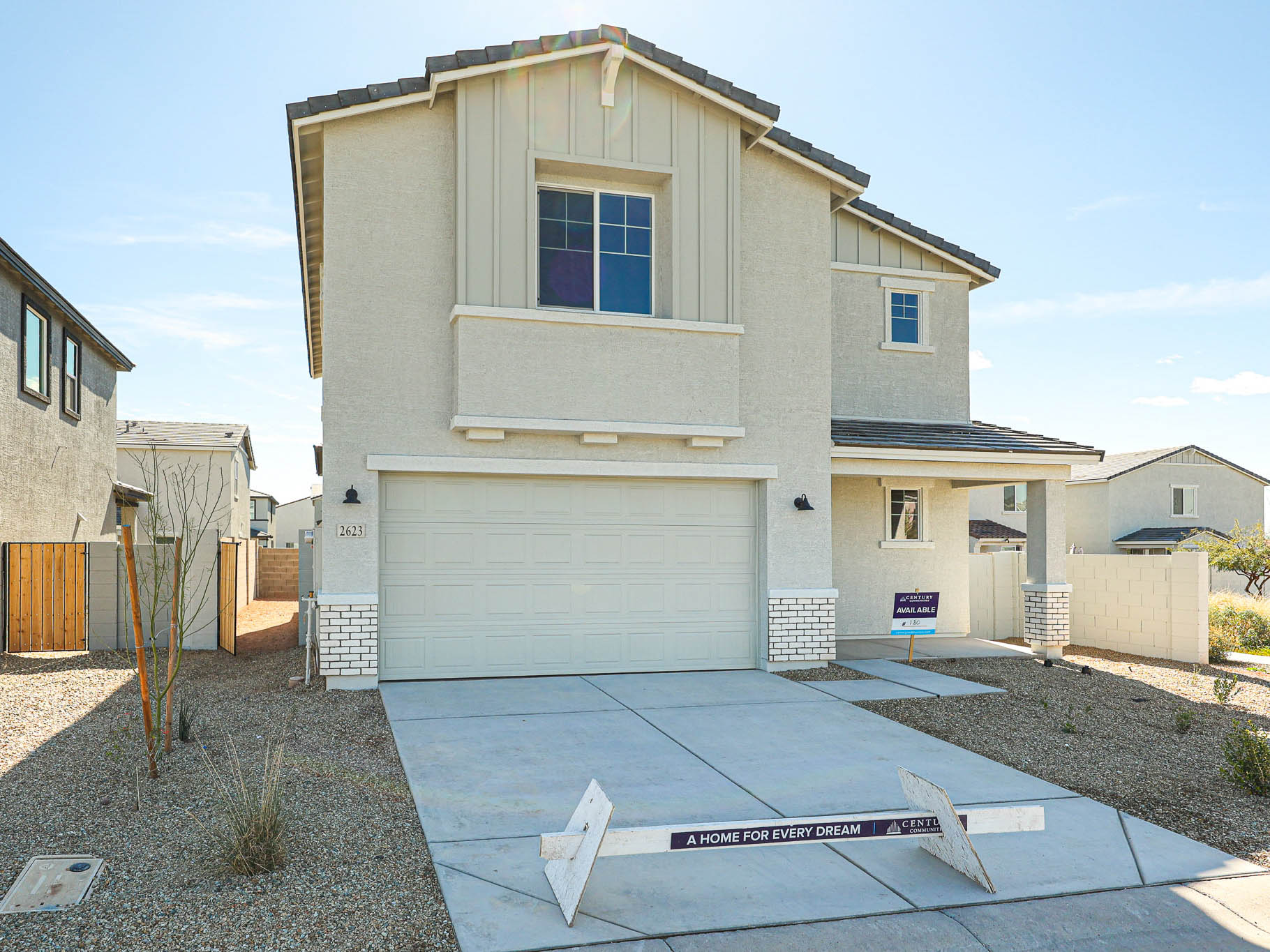 A white house with a garage.