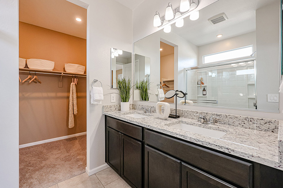 A bathroom with a marble countertop.
