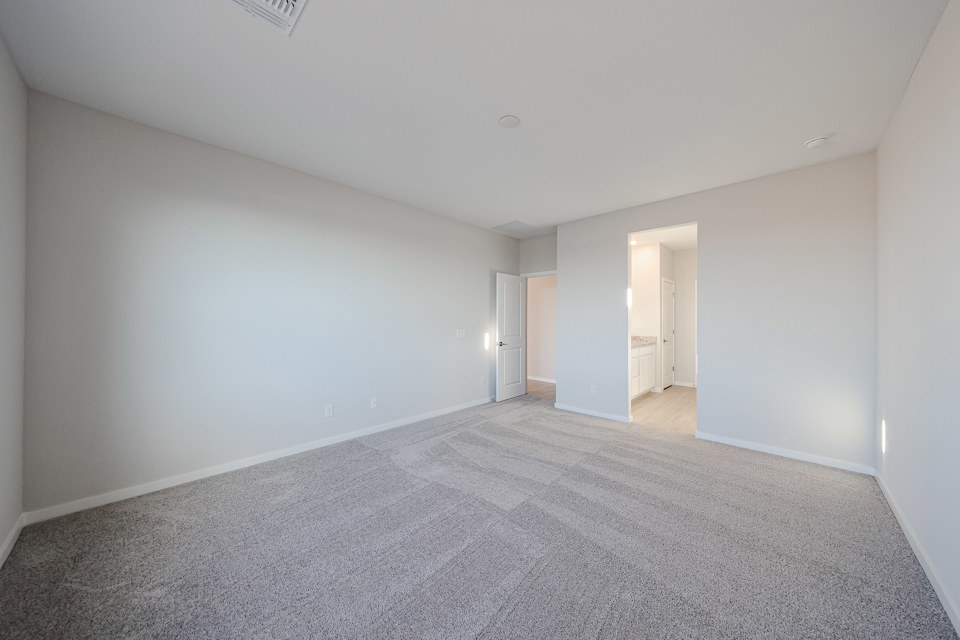 A long hallway with doors.