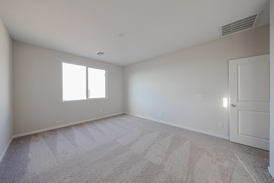 A room with a door and a window.