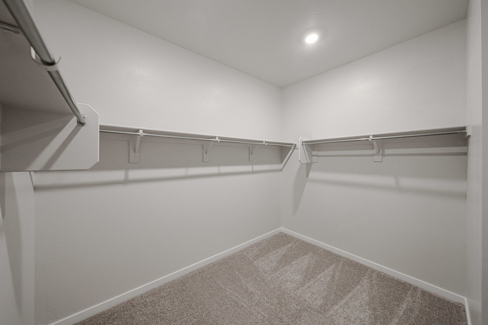 A hallway with white walls.