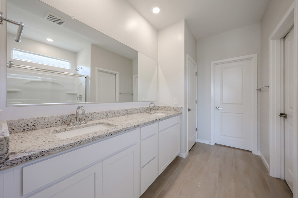 A bathroom with a marble countertop.
