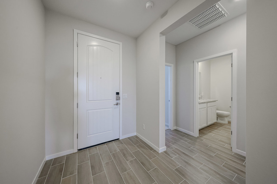 A bathroom with white walls.